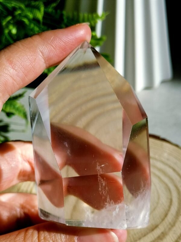 Clear quartz crystal point with phantom