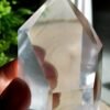 Clear quartz crystal point with phantom