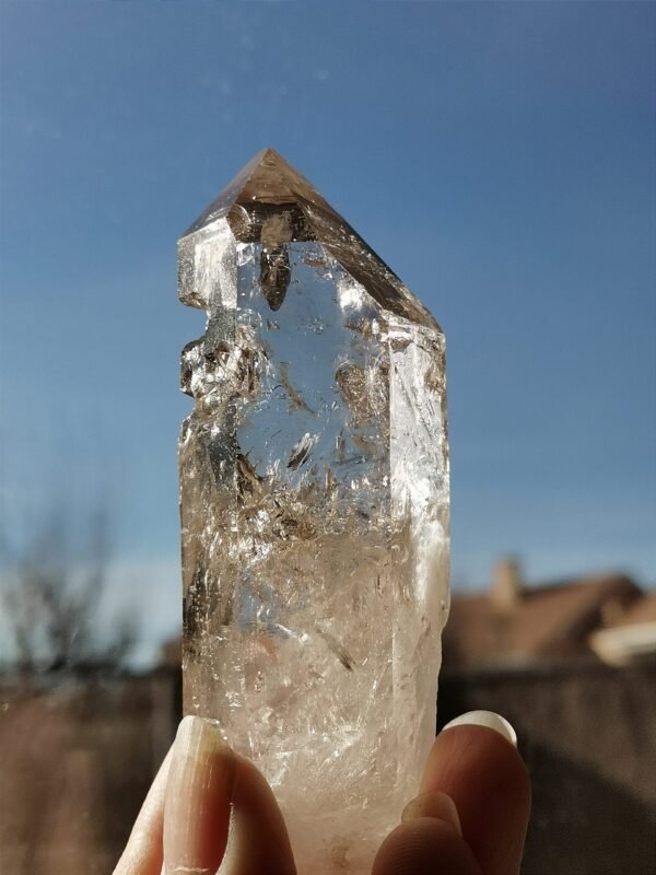 Clear quartz with inclusions and a rainbow effect