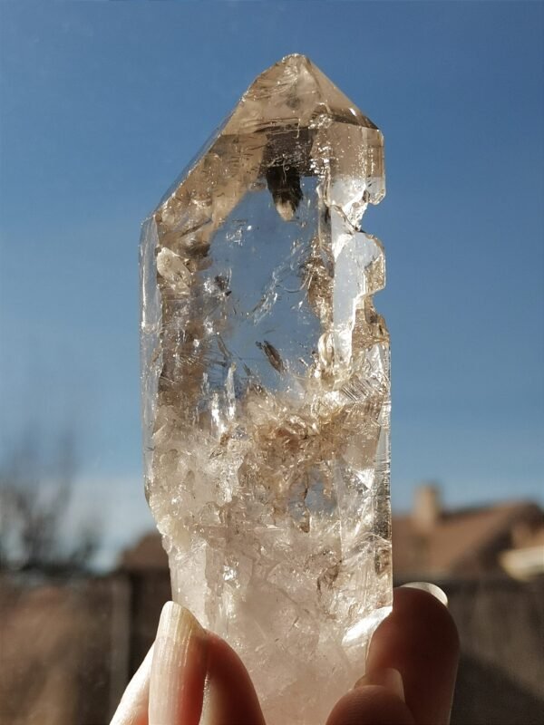 Clear quartz with inclusions and a rainbow effect