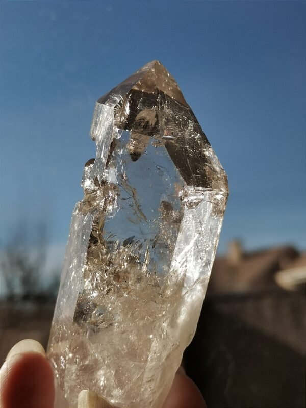 Clear quartz with inclusions and a rainbow effect