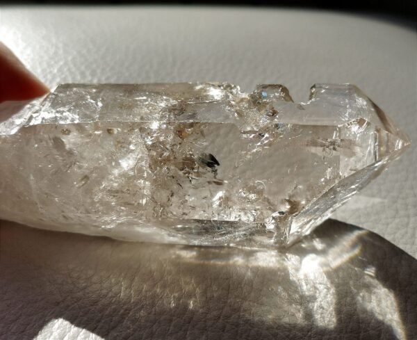 Clear quartz with inclusions and a rainbow effect