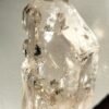 Clear quartz with inclusions and a rainbow effect