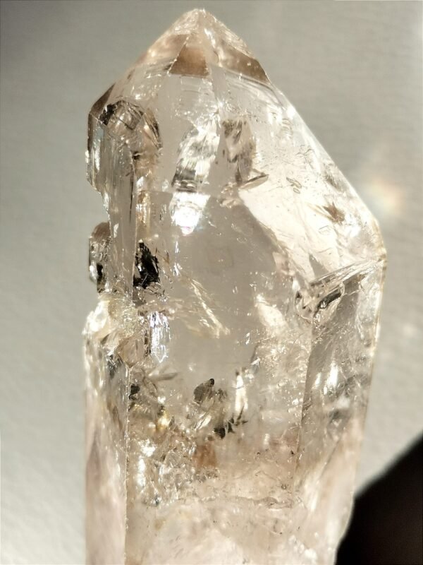 Clear quartz with inclusions and a rainbow effect