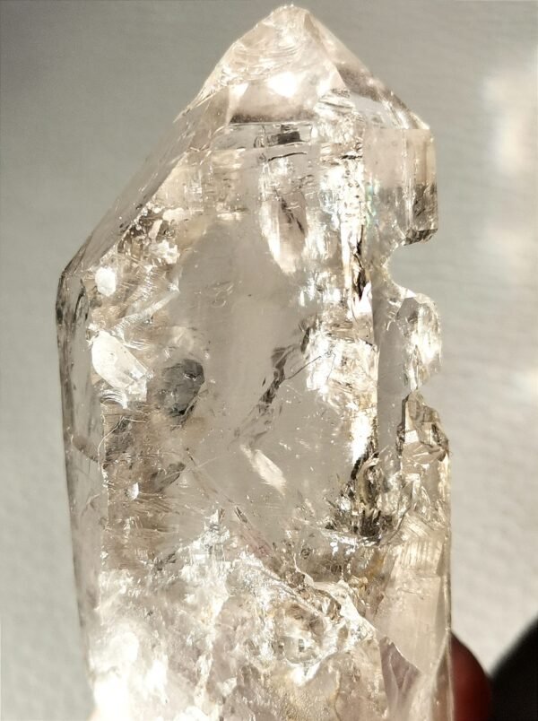 Clear quartz with inclusions and a rainbow effect