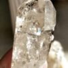 Clear quartz with inclusions and a rainbow effect