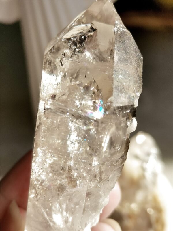 Clear quartz with inclusions and a rainbow effect