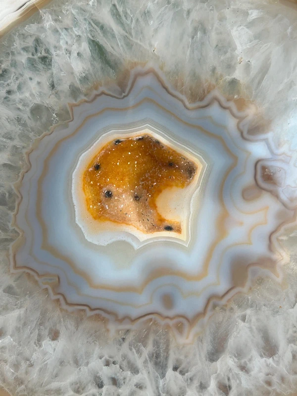 Natural white agate with yellow crystalline cavity