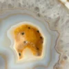 Natural white agate with yellow crystalline cavity