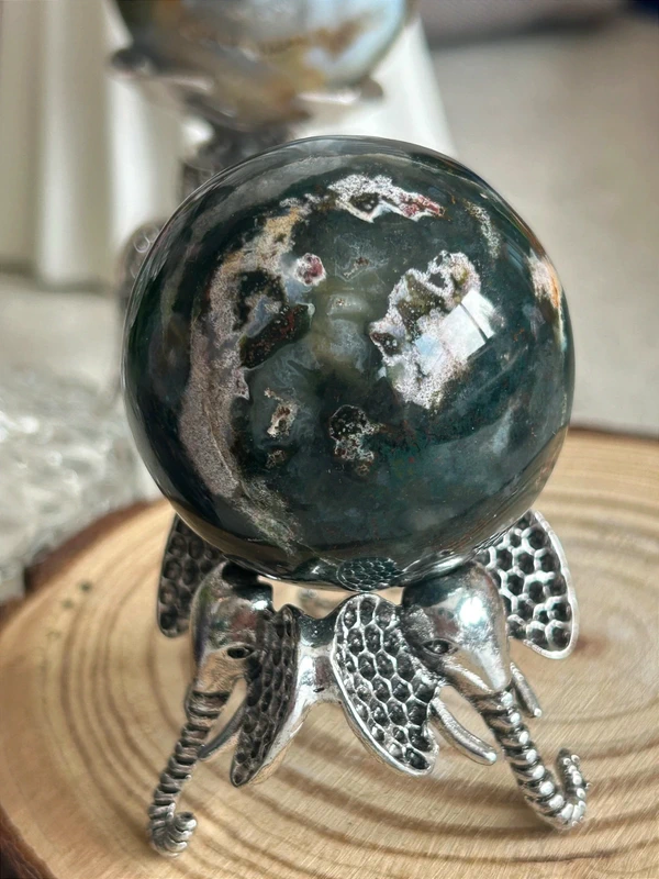 Natural agate sphere deep green