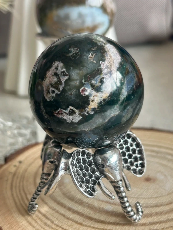 Natural agate sphere deep green