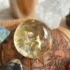 Yellow quartz sphere in crystal