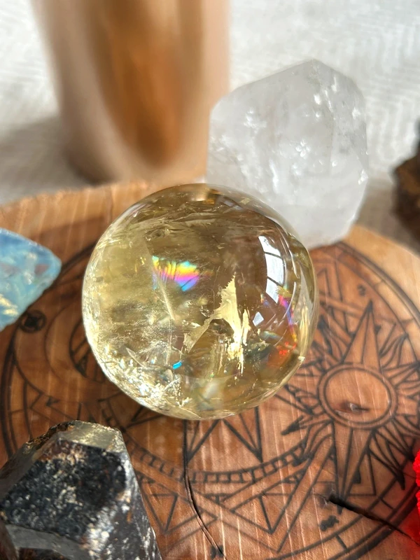 Yellow quartz sphere in crystal
