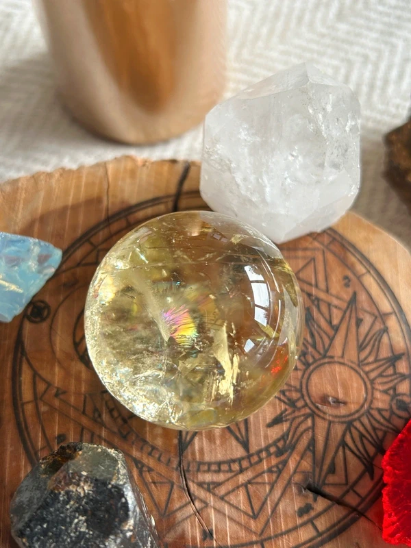 Yellow quartz sphere in crystal