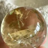 Yellow quartz sphere in crystal