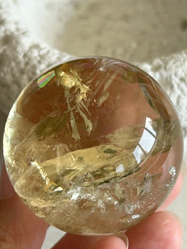 Yellow quartz sphere in crystal