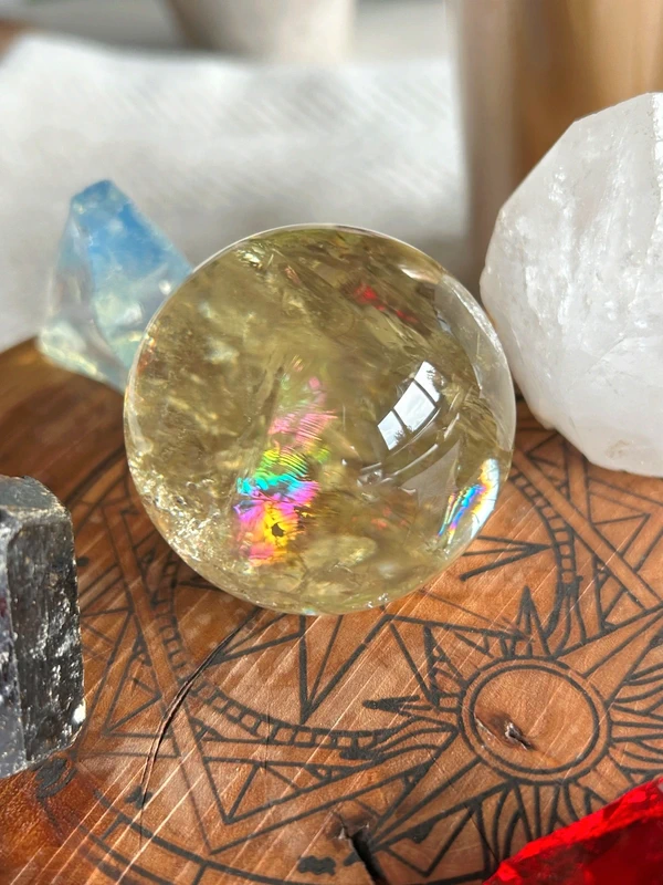 Yellow quartz sphere in crystal