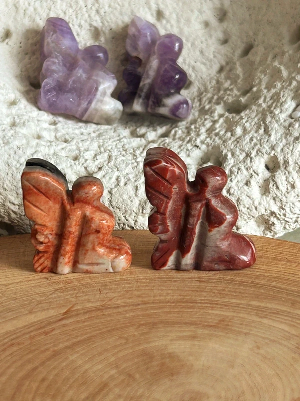 Small winged fairies in natural stone
