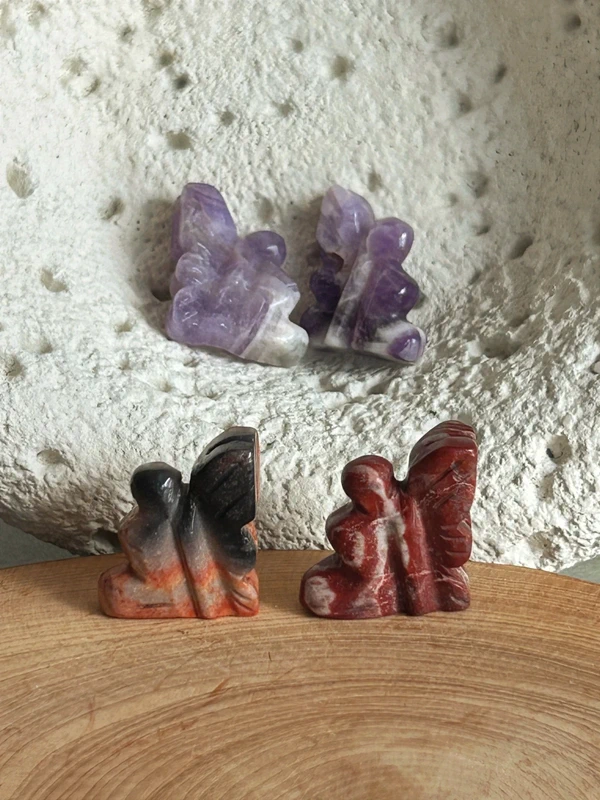 Small winged fairies in natural stone