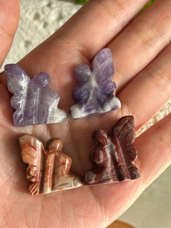 Small winged fairies in natural stone