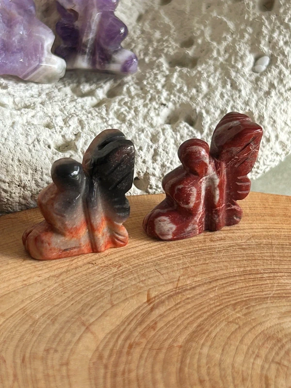 Small winged fairies in natural stone