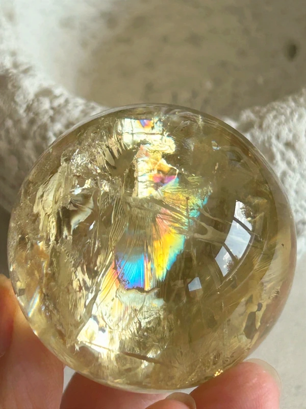 Yellow quartz sphere in crystal