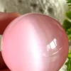 Pink cat's eye crystal sphere