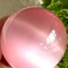 Pink cat's eye crystal sphere