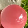 Pink cat's eye crystal sphere