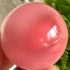 Pink cat's eye crystal sphere