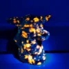Figura de Sabio Anciano tallada en piedra de fuego natural
