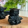 Figura de Sabio Anciano tallada en obsidiana/piedra de fuego natural